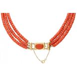 Three-row red coral necklace with a 14K. yellow gold closure.