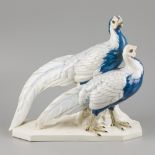 A porcelain sculpture group of a pair of gold pheasants, marked Passau, Germany, circa 1930.