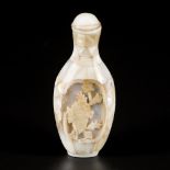 A mother-of- pearl snuff bottle with flower decoration, China, 19th century.