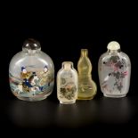 A lot comprised of (4) glass snuff bottles with various decorations, China, 1st half 20th century.