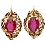 14K. Yellow gold openwork earrings set with approx. 1.07 ct. synthetic ruby.