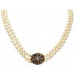 Two-row freshwater pearl necklace with a 14K. rose gold and 925/1000 silver closure set with diamond