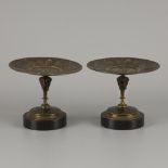 A couple of cast bronze tazza's with portraits of a Roman Imperial family in medallions.