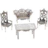 (4) piece of miniature silver furniture.