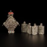 A lot comprising (2) Tibetan silver snuff bottles with floral decoration and characters, China, 19th