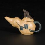 A gourd-shaped Yixing teapot, marked underneath, China, 20th century.