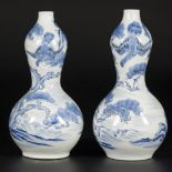 A set of (2) porcelain gourd vases decorated with falcons in a landscape, Japan, 19th century.