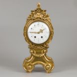 A Louis XV-style mantle clock in guiltwood and gesso case, 19th century.