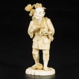 An ivory okimono of a pipe-smoking gentleman, Japan, late 19th century.