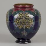 A polychrome painted earthenware vase with Jugendstil decoration, marked Rozenburg, The Hague, circa