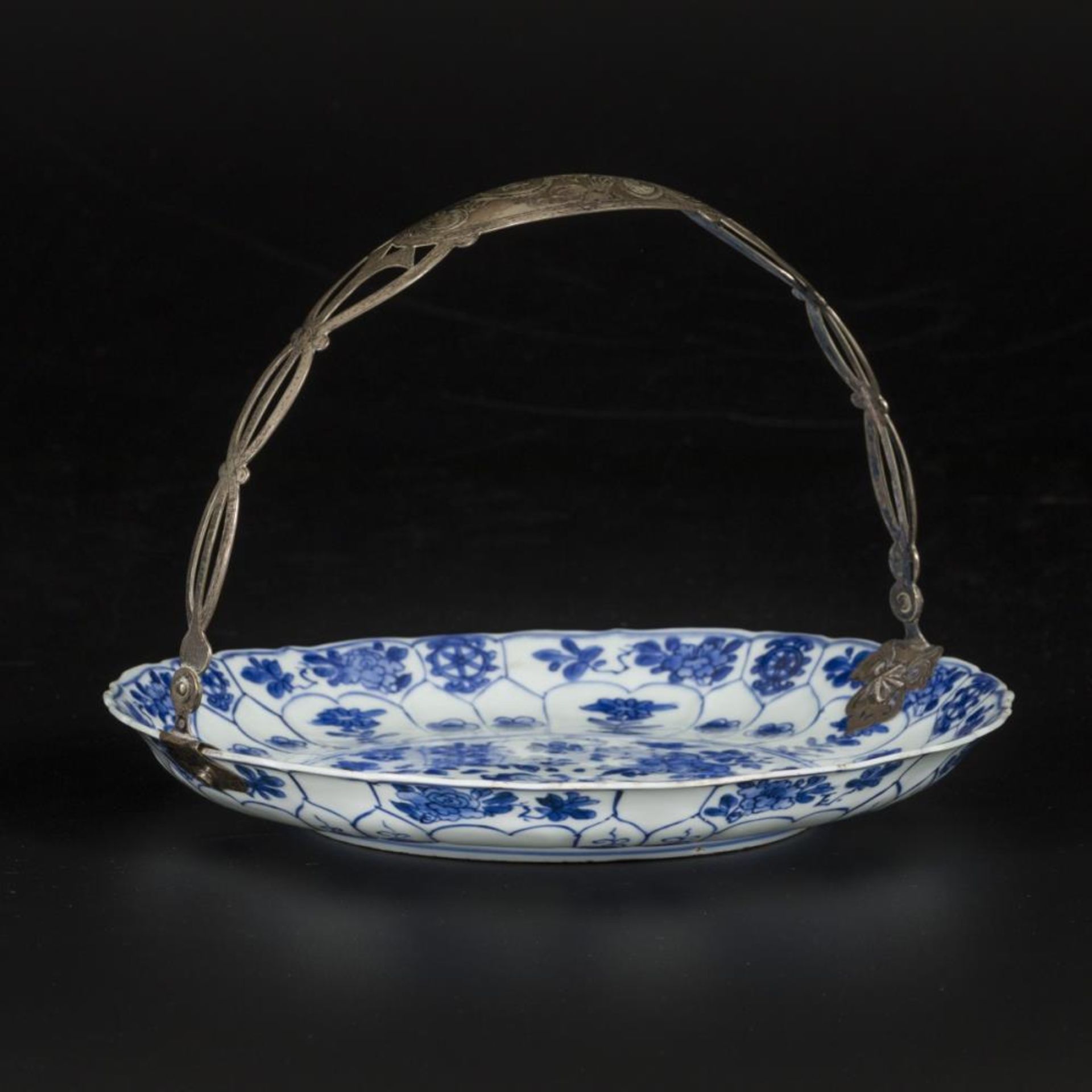 A porcelain charger with floral decoration, marked in period China, Kangxi.