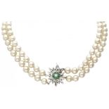 Two-row freshwater pearl necklace with a BLA 10K. white gold closure set with approx. 0.16 ct. natur