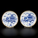 A set of (2) small porcelain saucers decorated with antiquities, marked Lingzhi, China, Yongh Zheng.