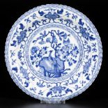 A ribbed porcelain plate with decor of bird on rock, China, Kangxi.