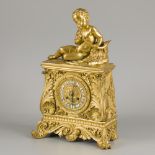 A firegilt clock with music playing boy, Denière à Paris, France, around 1830.