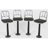 A lot comprised of (4) design swivel bar stool/ counterchairs, U.S.A., 1931.