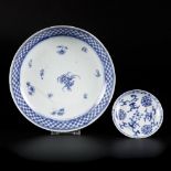 A deep porcelain plate and one saucer with floral decoration, China, 18th century.