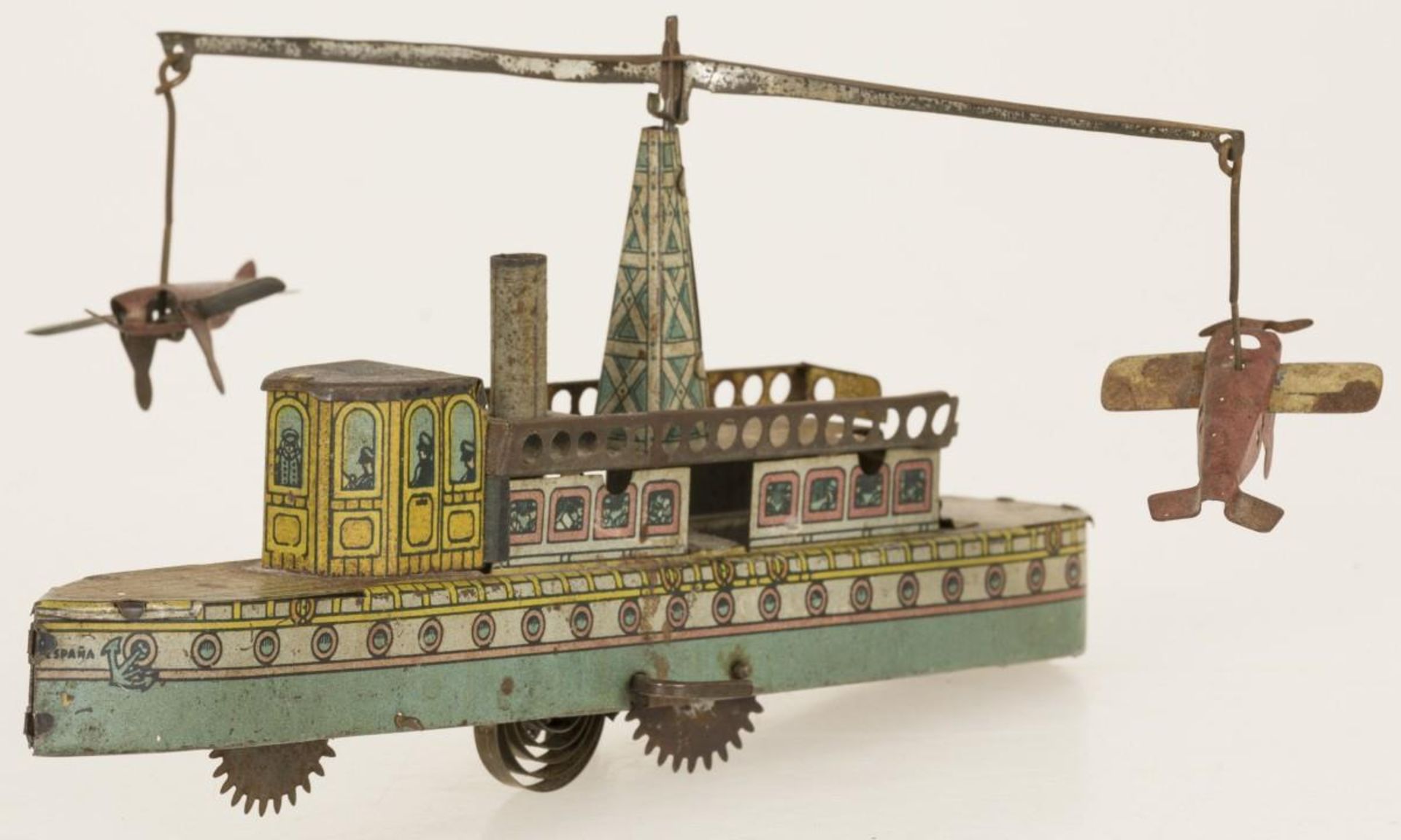Rico Spain tin wind-up toy ship with airplanes
