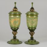 A set of (2) green glass lidded coupes, France, early 20th century.