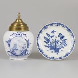 A lot comprising various pottery a.w. a plate with floral decoration and a tobacco jar "De Vriessche