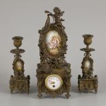 A 19th C. bronze garniture de cheminee with handpainted plaquettes depicting scenes after Fragonard.