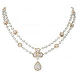 18K. Bicolor gold entourage necklace set with approx. 4.66 ct. diamond.
