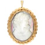 Antique pendant / brooch with a mother of pearl cameo in a 14K. yellow gold frame.