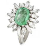 18K. White gold entourage ring set with approx. 1.44 ct. diamond and approx. 1.30 ct. emerald.