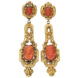 18K. Yellow gold antique earrings set with four red coral cameos.
