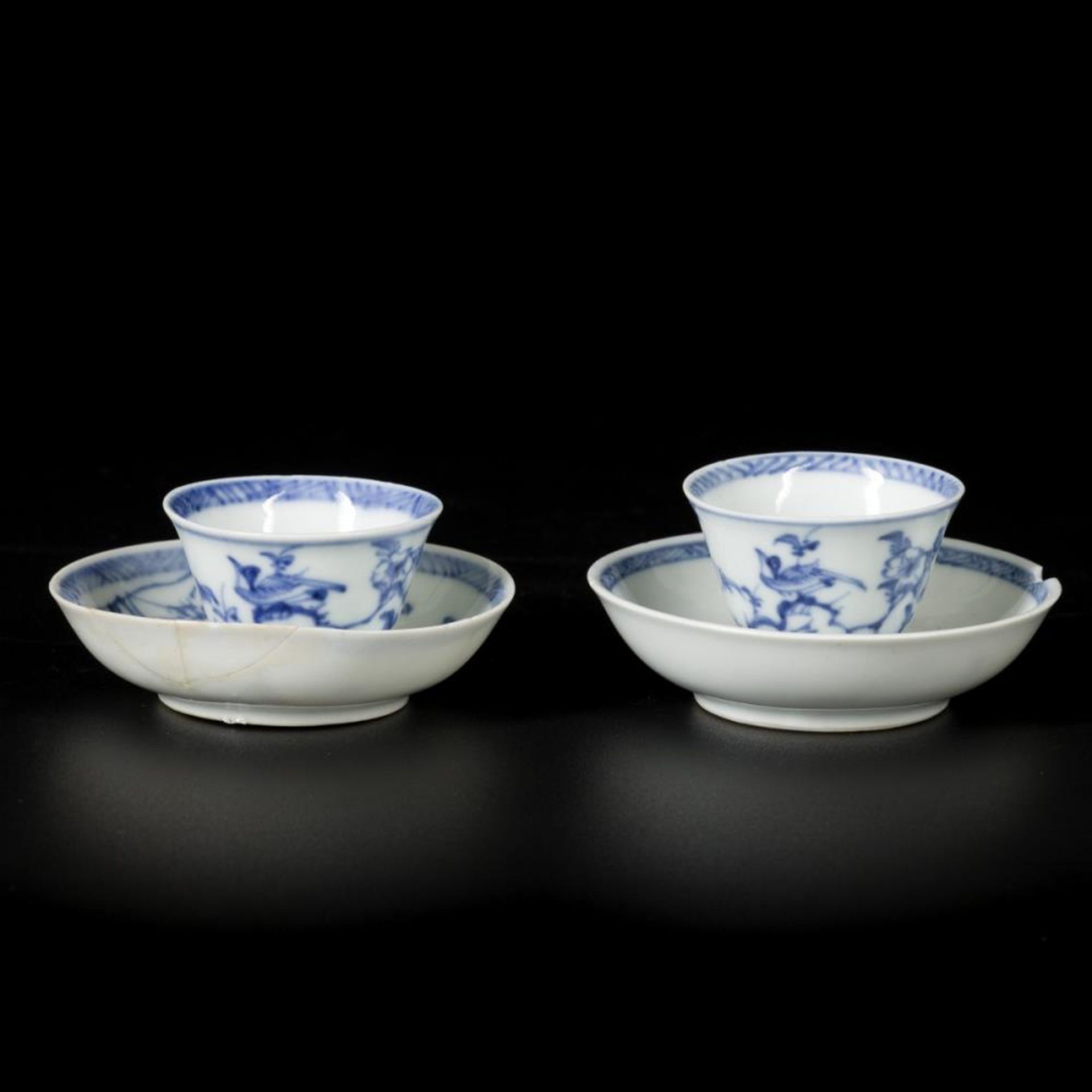 A lot of (2) porcelain cups and saucers with birds/floral decoration, small-model, China, Kangxi.