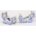 A set of (2) earthenware sledges decorated with a Dutch scene. Delft, 1st half 20th century.