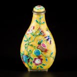 An enamel snuff bottle decorated with flowers and birds, China, 19th century.