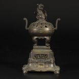 A bronze incense burner with a foo-dog on the lid, China, 19th century.