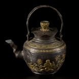 A bronze teapot with faux bamboo handles and decorated with raised relief, China, 1st half of the 20