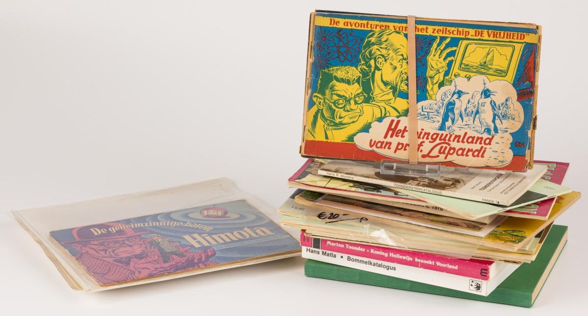 A lot comprised of various books and comic albums, a.w. the "Avonturen van Tom POes", 20th century.