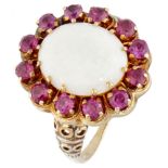 BLA 10K. Yellow gold entourage ring set with approx. 2.36 ct. precious opal and approx. 1.08 ct. rub