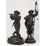 A lot comprising (2) ZAMAC sculptures of a soldier wielding a so-called "Zweihänder" standing on the