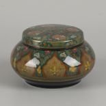 A Gouda earthenware lidded box with floral decoration, model Diana.