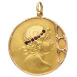 18K. Yellow gold Art Nouveau pendant with an elegant lady set with glass garnet.
