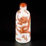 A porcelain snuff bottle with dragon decoration, marked in period, China, Doagoang.