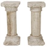 A set of (2) marble columns with Corinthian capital.