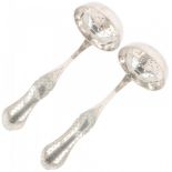 (2) piece set of silver sprinkler spoons.