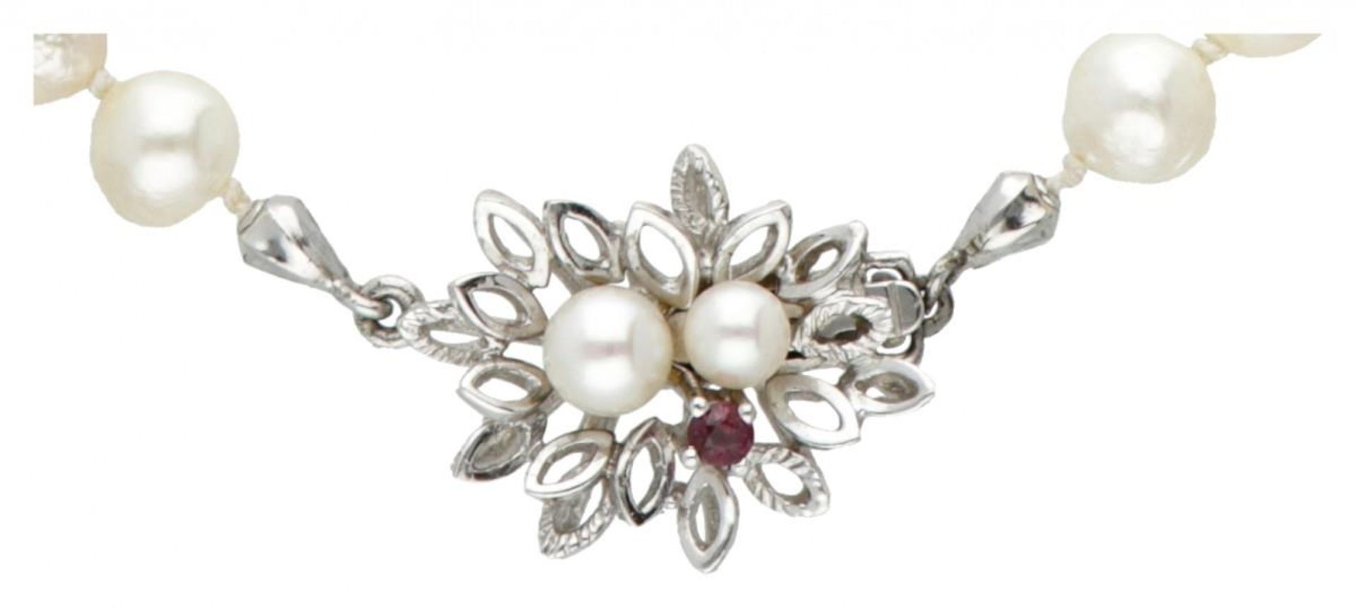Single strand pearl necklace with a 14K. white gold closure set with pearl and ruby. - Image 2 of 3