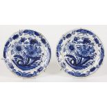 A set of (2) earthenware plates with floral decor. Delft, 18th century.