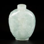 A jadeite snuff bottle decorated with crane and pinus, China, 1st half 20th century.