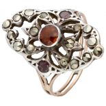 18K. Rose gold openwork ring set with orange garnet and marcasite in silver.