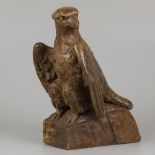 A wooden sculpture of an eagle, ca. 1920.
