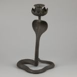 A bronze candle stick holder in Egyptian style, in the shape of a cobra snake, France, ca. 1920.