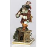 A porcelain Rudolstadt figurine of a musketeer packing his pipe, Germany, 20th century.