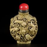 A bronze snuff bottle with movable Qiling decor, China, 19th century.